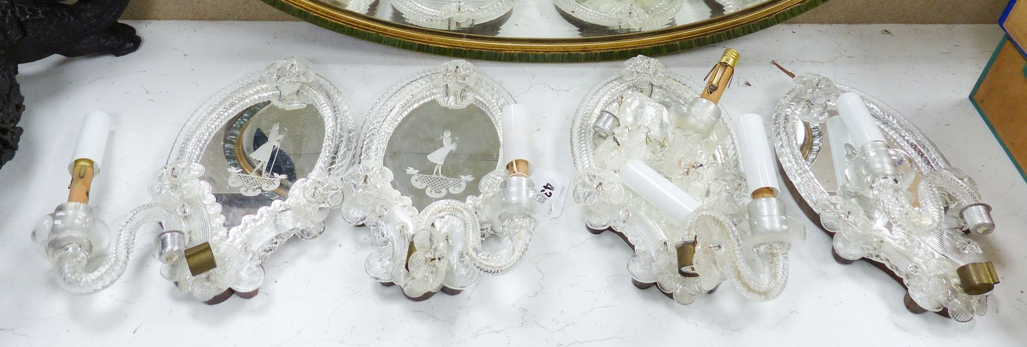 A set of four Venetian glass mirrored girandole mirrors, 25cm